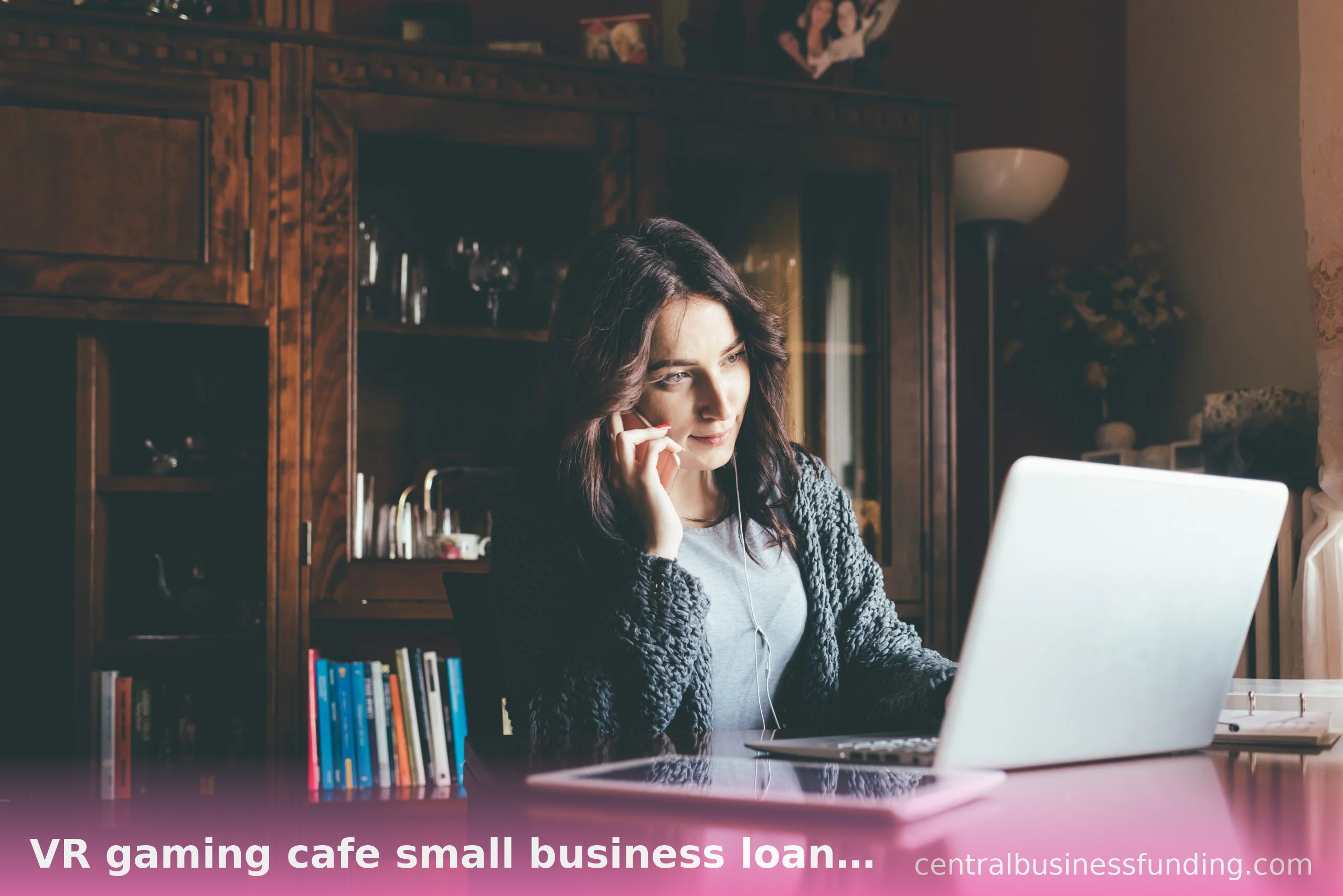 Woman researching VR gaming cafe small business loans on her laptop at home